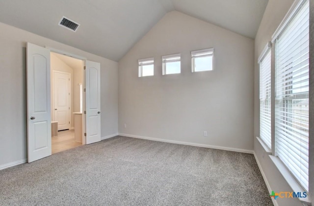 2055 Stephanie Ave, New Braunfels, TX 78132 - unfurnished bedroom featuring carpet, lofted ceiling, and baseboards