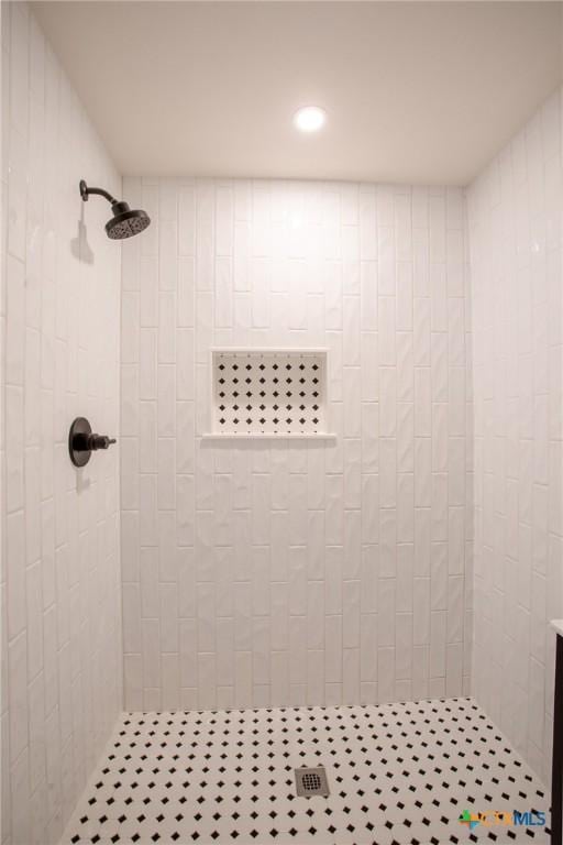 bathroom with tiled shower