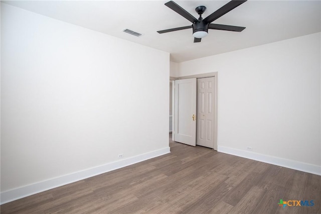 spare room with ceiling fan and hardwood / wood-style floors