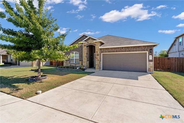 view of front facade with a garage and a front yard