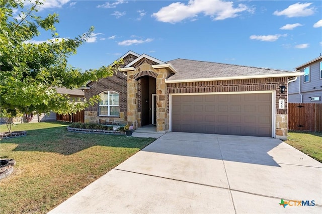 view of front of property with a garage and a front yard