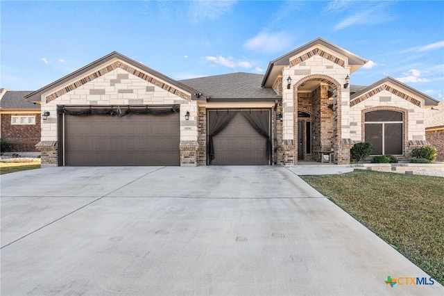 view of front of property with a garage