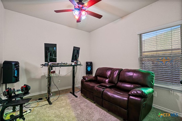 carpeted living room featuring ceiling fan