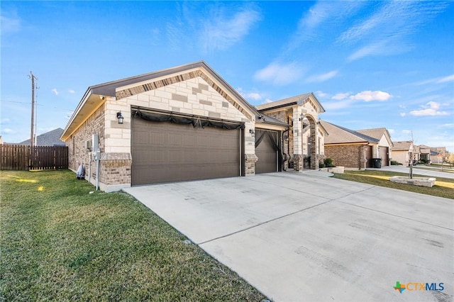 view of front of home with a front lawn and a garage