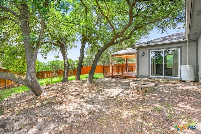 view of yard featuring a gazebo and a deck