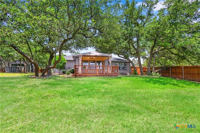 view of yard with a wooden deck