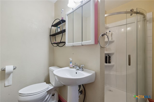 bathroom with walk in shower and toilet