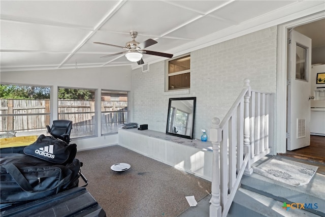 sunroom featuring ceiling fan and lofted ceiling