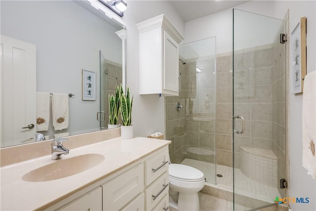 bathroom with vanity, toilet, and walk in shower