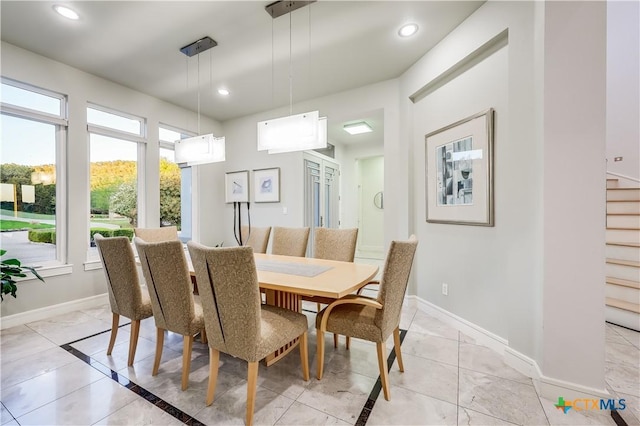 dining space with light tile patterned flooring