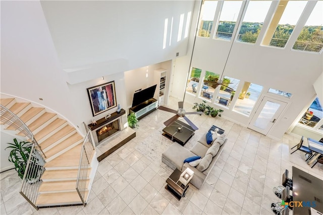 living room with a towering ceiling