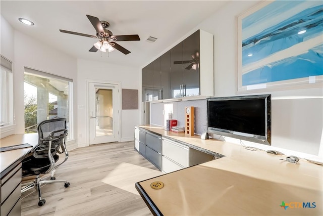 office space featuring ceiling fan and light hardwood / wood-style floors