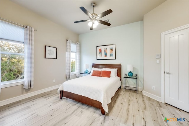 bedroom featuring ceiling fan and light wood-type flooring