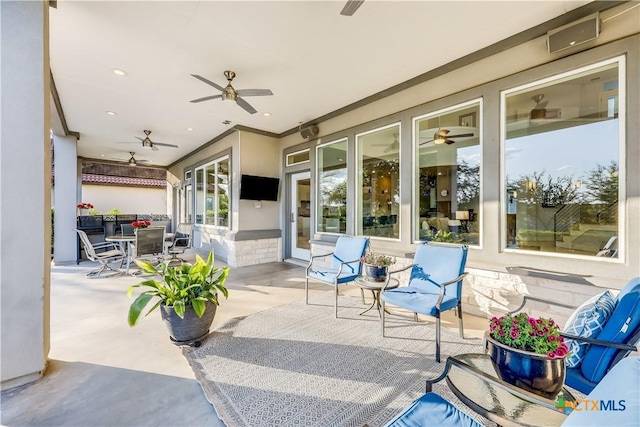 view of patio with ceiling fan