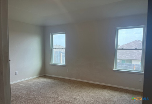 19712 Abigail Fillmore Rd, Manor, TX 78653 - carpeted empty room with baseboards