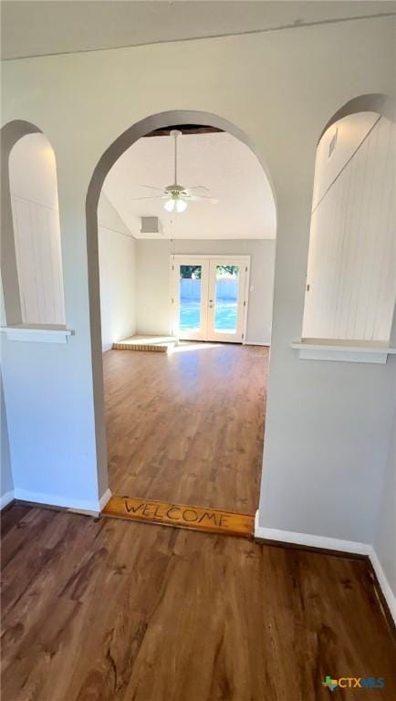 5407 Shirley St, Baytown, TX 77521 - unfurnished room featuring ceiling fan, wood finished floors, baseboards, and arched walkways