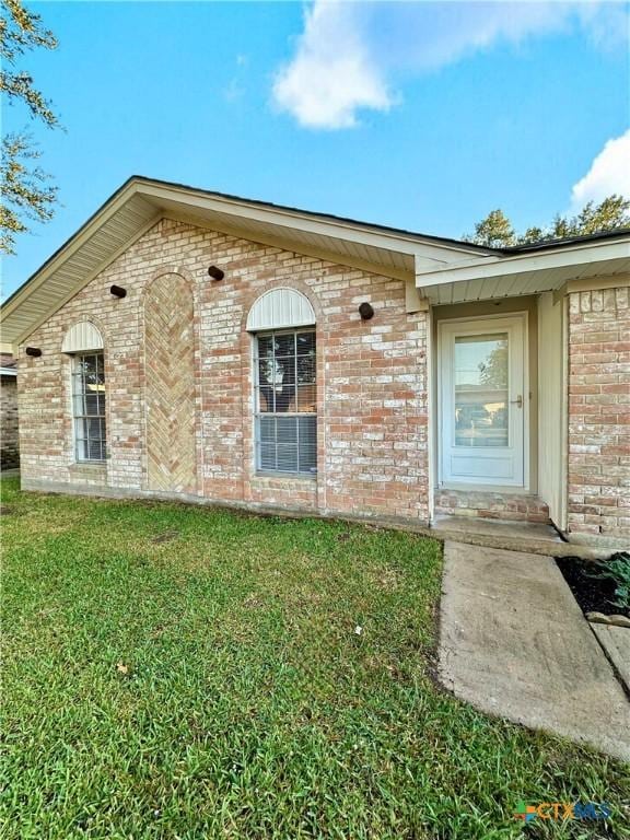 5407 Shirley St, Baytown, TX 77521 - view of front of house with brick siding and a front yard