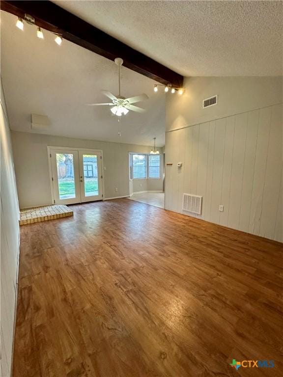 5407 Shirley St, Baytown, TX 77521 - unfurnished living room featuring wood finished floors, ceiling fan, french doors, and a textured ceiling