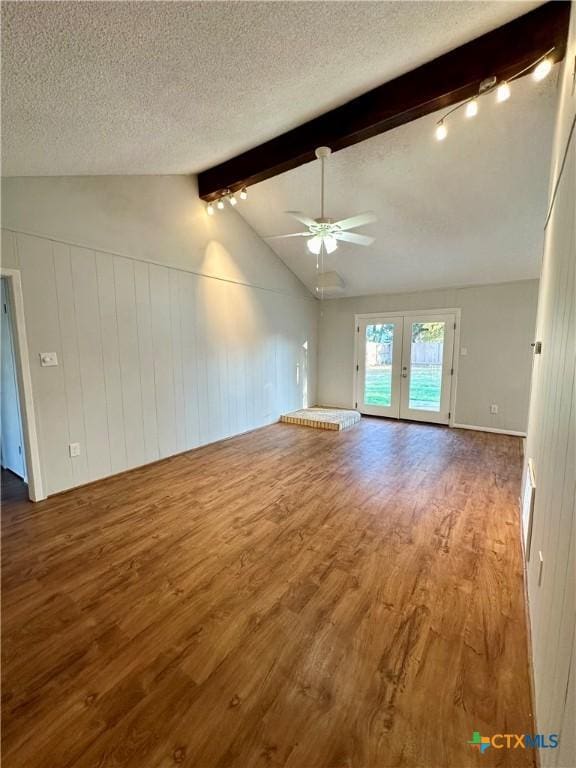 5407 Shirley St, Baytown, TX 77521 - unfurnished living room with wood finished floors, ceiling fan, french doors, a textured ceiling, and track lighting