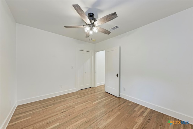 unfurnished room with ceiling fan and light hardwood / wood-style floors