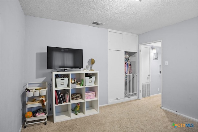 138 Antrim Dr, San Antonio, TX 78218 - bedroom with carpet, a textured ceiling, and baseboards