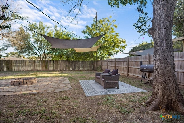 138 Antrim Dr, San Antonio, TX 78218 - fenced backyard with an outdoor fire pit and a patio
