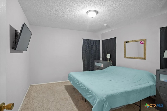 138 Antrim Dr, San Antonio, TX 78218 - carpeted bedroom featuring a textured ceiling and baseboards