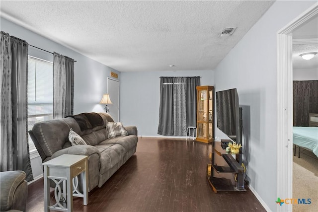 138 Antrim Dr, San Antonio, TX 78218 - living room featuring a textured ceiling, wood finished floors, and baseboards