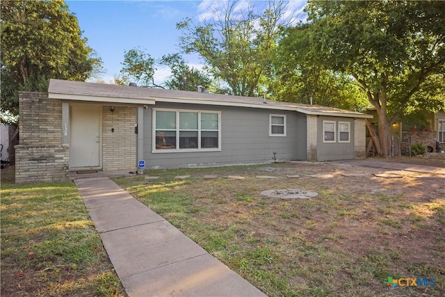 138 Antrim Dr, San Antonio, TX 78218 - view of front of house with brick siding and a front lawn