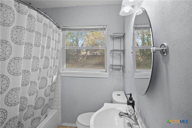 138 Antrim Dr, San Antonio, TX 78218 - bathroom featuring plenty of natural light, toilet, shower / tub combo, and a sink