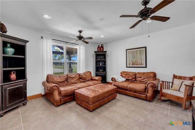 living room featuring light tile patterned flooring and ceiling fan