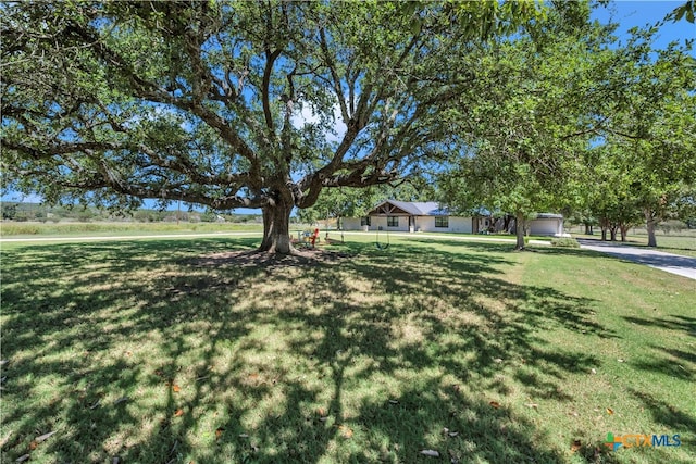 view of yard with a garage