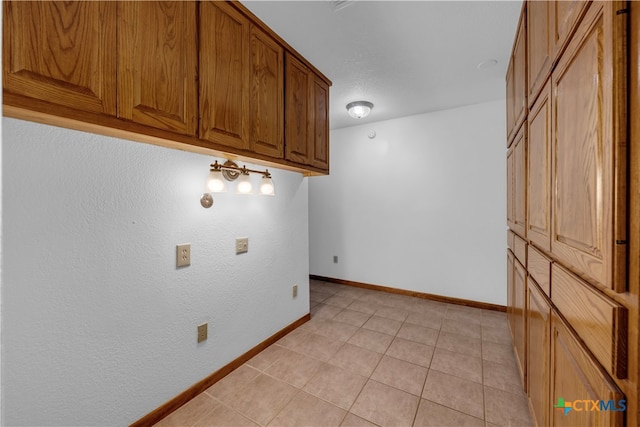 washroom featuring light tile patterned flooring