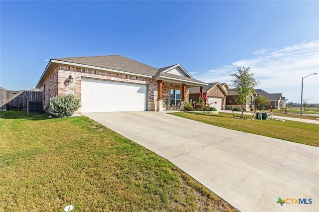 single story home featuring an attached garage, concrete driveway, a front lawn, and fence