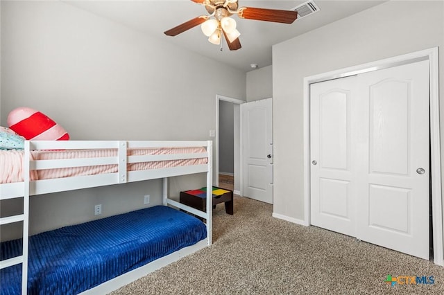 unfurnished bedroom featuring visible vents, baseboards, carpet floors, a closet, and a ceiling fan