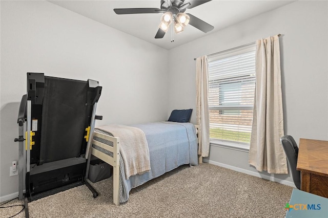 carpeted bedroom featuring ceiling fan and baseboards