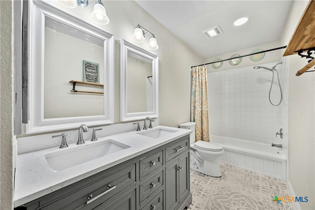 full bathroom featuring tile patterned floors, vanity, shower / bath combination with curtain, and toilet