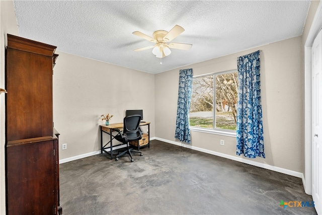 office area with ceiling fan and a textured ceiling