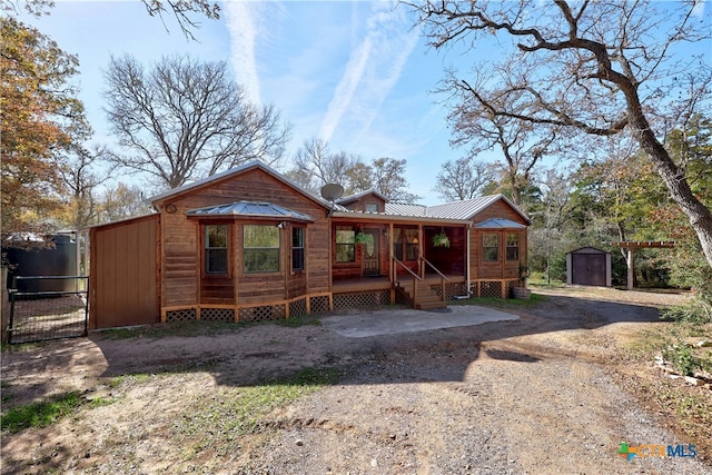 view of front of home with a storage unit