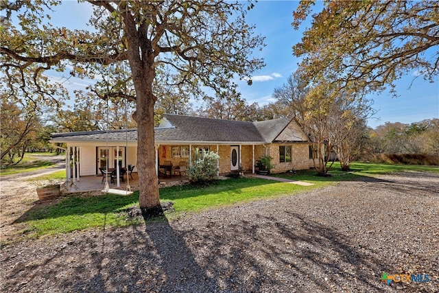 single story home featuring a patio area and a front yard