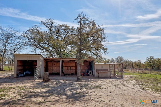 view of outbuilding featuring a rural view