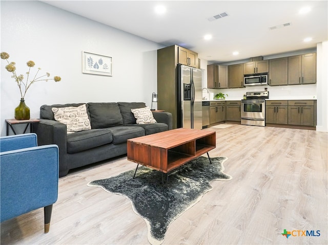 living room featuring light wood-type flooring