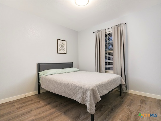 bedroom featuring wood-type flooring