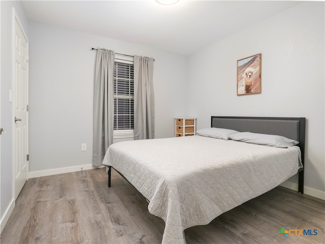 bedroom featuring hardwood / wood-style floors