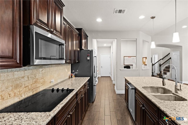 3256 Province Pt, Harker Heights, TX 76548 - kitchen featuring stainless steel appliances, tasteful backsplash, dark wood-type flooring, light stone counters, and recessed lighting