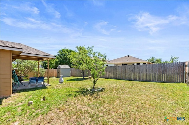 view of yard featuring a fenced backyard, an outdoor structure, a patio area, and a storage shed