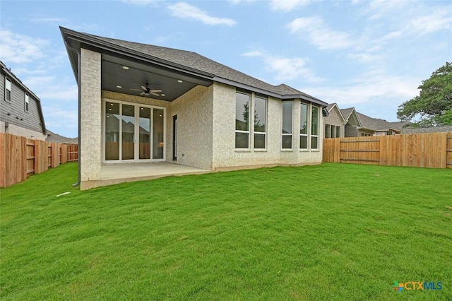 264 Five Mile Creek Way, Kyle, TX 78640 - back of property with a ceiling fan, a patio, and brick siding