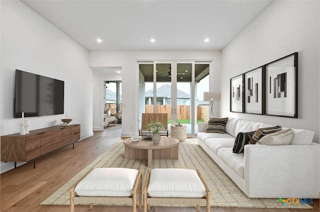 264 Five Mile Creek Way, Kyle, TX 78640 - living area featuring wood finished floors, recessed lighting, and french doors