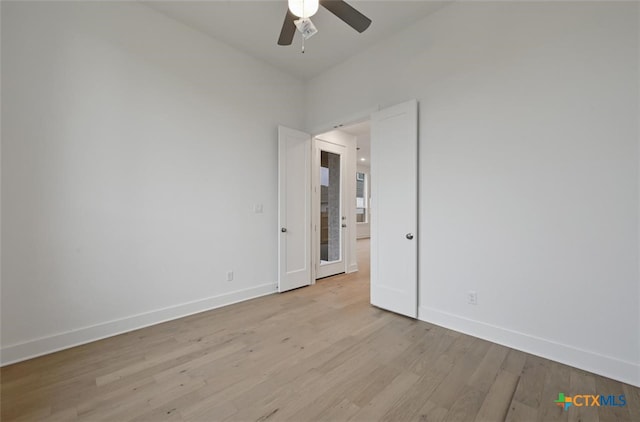 264 Five Mile Creek Way, Kyle, TX 78640 - unfurnished room with ceiling fan, baseboards, and light wood-style floors
