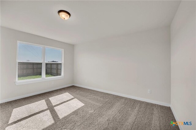 unfurnished bedroom featuring dark colored carpet